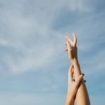 Hands reaching for the sky during stretch