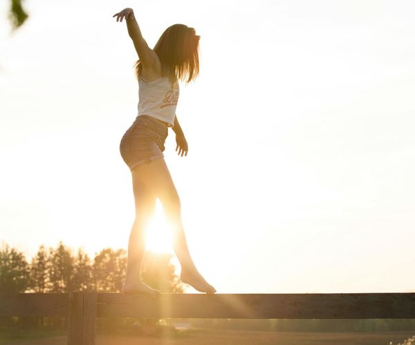 Person balancing and feeling energetic outdoors