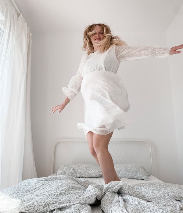 Person doing light morning movements in a bright room